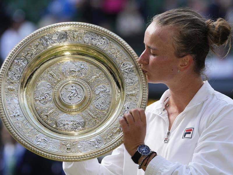 Barbora Krejcikova kisses the Venus Rosewater Dish after winning the Wimbledon ladies' singles. (AP PHOTO)