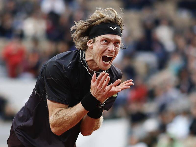 Andrey Rublev vents his frustration after a missed shot during his loss to Matteo Arnaldi. (AP PHOTO)