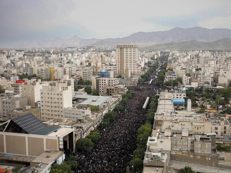 The streets of Mashhad have been packed with people for the funeral of late president Ebrahim Raisi. (EPA PHOTO)