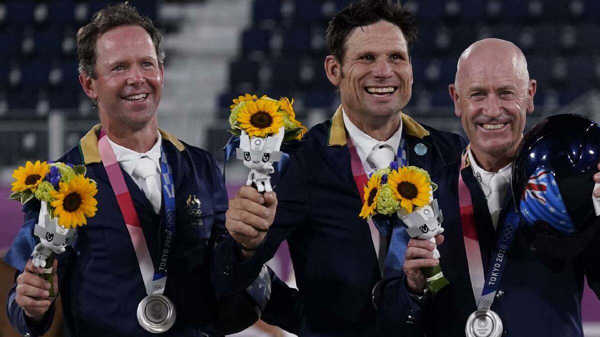 Kevin McNab, Shane Rose and Andrew Hoy won silver in team eventing at the Tokyo Olympics. (AP PHOTO)