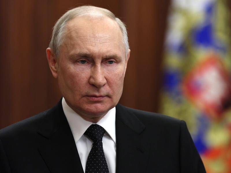 In a TV address, Vladimir Putin has warned of "inevitable punishment" for forces dividing Russia. (AP)