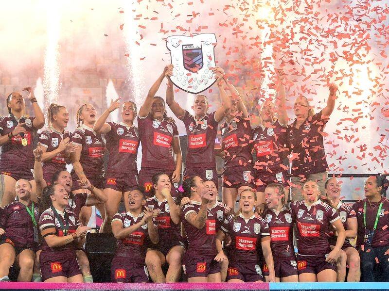 Queensland celebrate their win in a landmark edition of the Women's State of Origin. (Scott Radford-Chisholm/AAP PHOTOS)