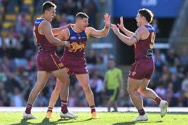 Brisbane have edged ladder leaders Sydney by two points in an AFL nail-biter at the Gabba. Photo: Darren England/AAP PHOTOS