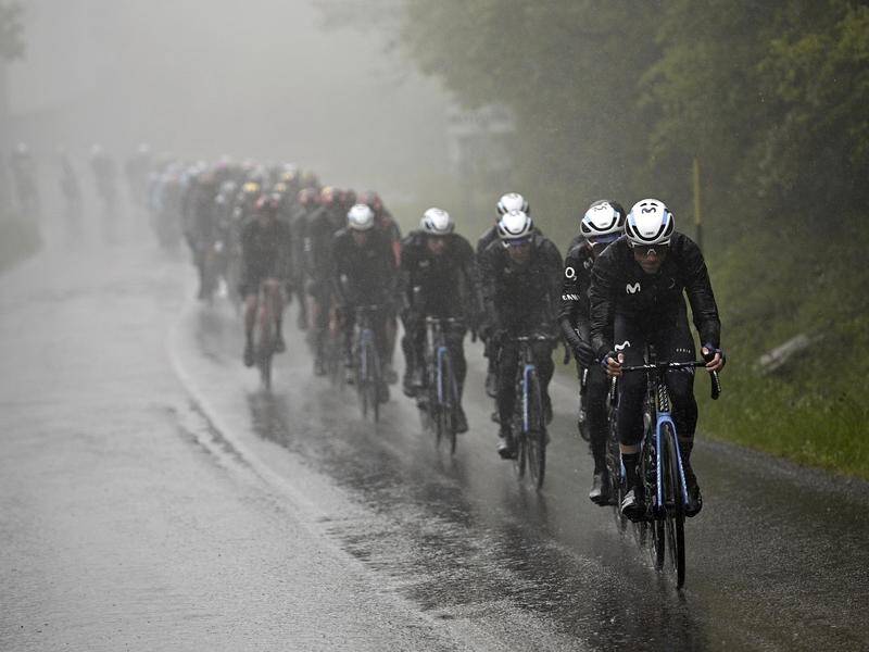 Riders faced horrible conditions during the 10th stage of the Giro d'Italia, won by Magnus Cort. (AP PHOTO)