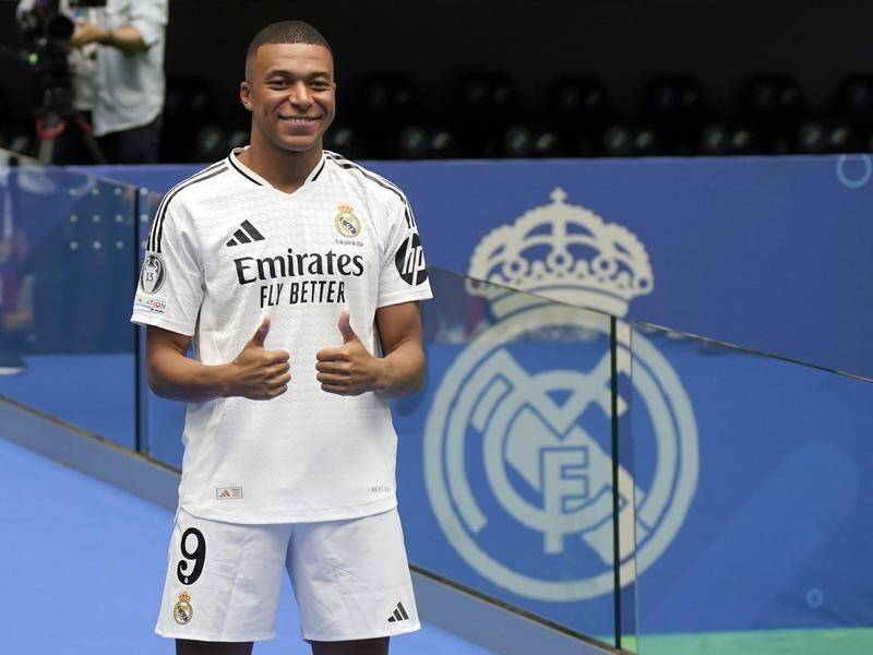 Kylian Mbappe was unveiled as a Real Madrid player at a packed Santiago Bernabeu stadium. (AP PHOTO)