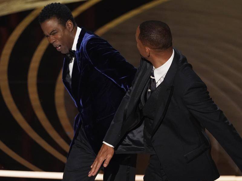Chris Rock has told an audience he's still processing what happened with Will Smith at the Oscars.