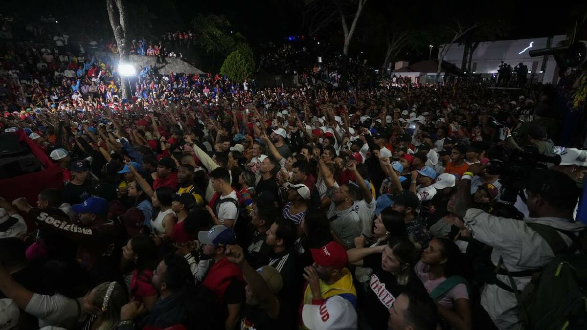 Supporters of President Nicolas Maduro await the results of the election in Caracas. (AP PHOTO)