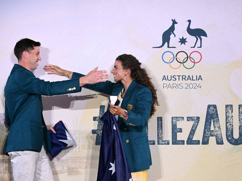 Eddie Ockenden and Jessica Fox are rapt to be the Australian flag bearers at the opening ceremony. Photo: Dave Hunt/AAP PHOTOS