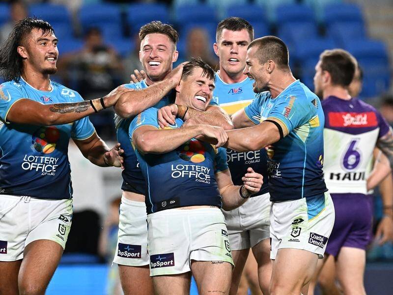AJ Brimson (c) has added another four years to his contract at the Gold Coast Titans. (Dave Hunt/AAP PHOTOS)