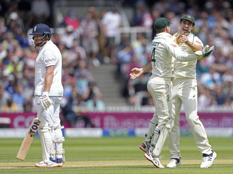 Pat Cummins and Alex Carey celebrate the dismissal of England's Jonny Bairstow at Lord's. (AP PHOTO)