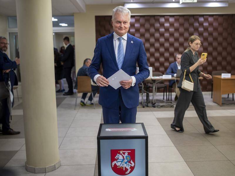 Gitanas Nauseda casts his ballot at a polling station during Lithuania's presidential elections. (AP PHOTO)