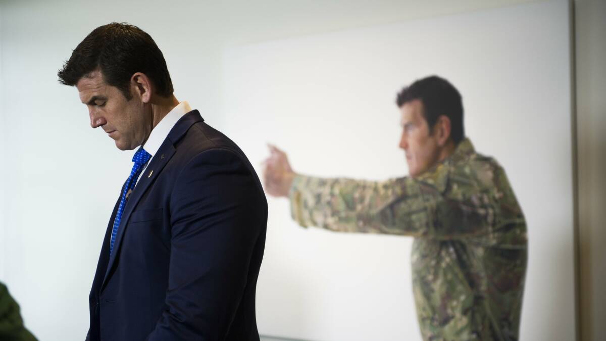 Ben Roberts-Smith with the portrait, which is no longer on view. Picture by Jay Cronan
