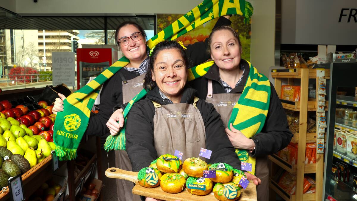 The Corner Market's Veronica Olmos, Rebeca Sotomayor and Katherine Olmos with their Matildas-inspired doughnuts. Picture by Sitthixay Ditthavong