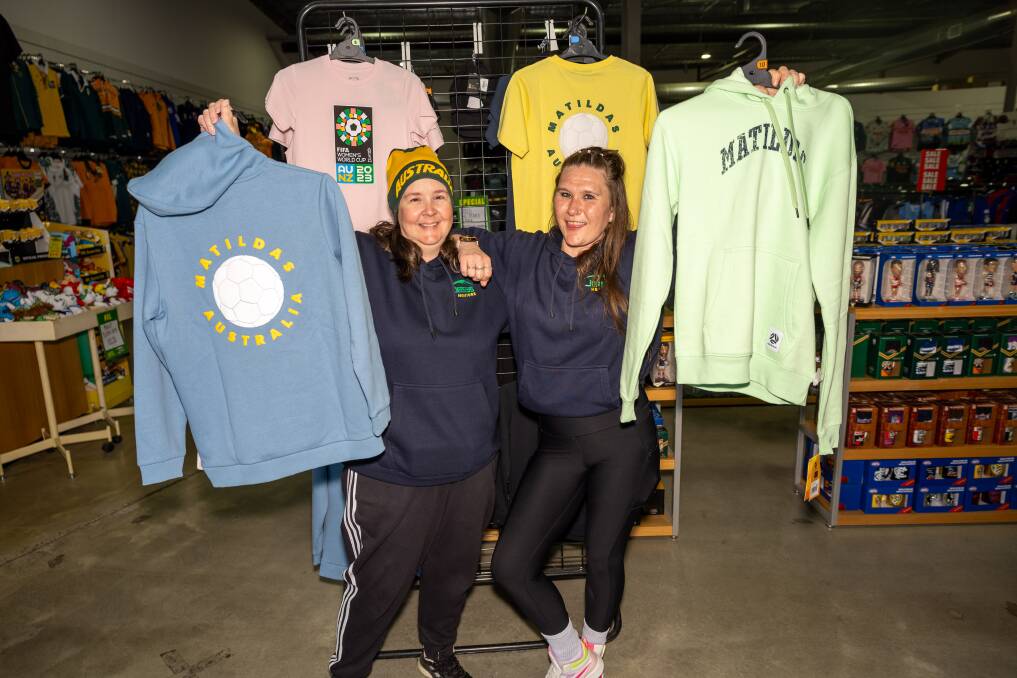 Jerseys Megastore workers Lauren Wright and Leah Sparrow with the last Matildas stock items in the store. Picture by Gary Ramage