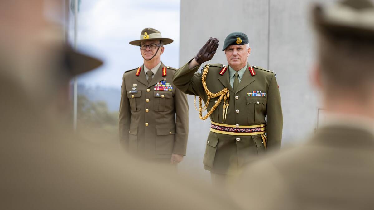 The New Zealand Chief of Army Major General John Boswell (right), receives a general salute from Australia's Federation Guard during a visit to army headquarters in Canberra. Alongside him is Australia's Chief of Army, Lieutenant General Rick Burr.