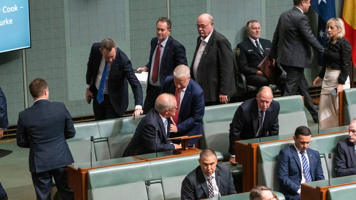 Liberals and Nationals lined up to shake hands with Mr Morrison after the speech. Picture by Elesa Kurtz