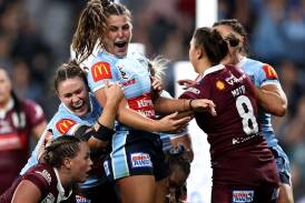 Jess Sergis (c) celebrates scoring for the Sky Blues during game one of the 2023 State of Origin. (Brendon Thorne/AAP PHOTOS)