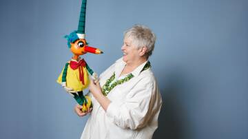 Rebecca Hetherington with iconic children's character Mr Squiggle, who will be on display at the National Museum. Picture by Sitthixay Ditthavong