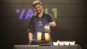 Alex Royds works the cheese at The Vault. Picture by Keegan Carroll