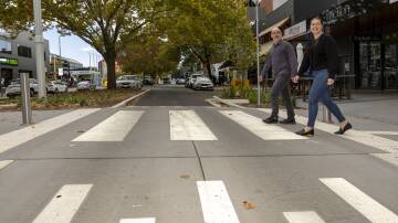 Braddon local Amy Jelacic, right, with Paris Lord on the new raised crossings in Lonsdale Street. Picture by Gary Ramage