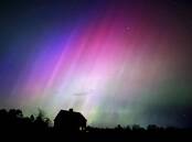 A severe geomagnetic storm is lighting up skies across the northern hemisphere as it hits earth. (AP PHOTO)