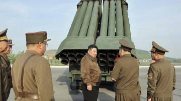 Kim Jong-un has supervised a test firing of a new multiple rocket launch system in North Korea. (AP PHOTO)