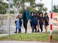 Ngunnawal Primary School deputy principal Emma Davidson and students prepare for Friday's National Walk Safely to School Day. Picture by Elesa Kurtz