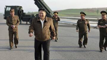 North Korean leader Kim Jong-un has visited arms factories to inspect rocket launchers. (AP PHOTO)
